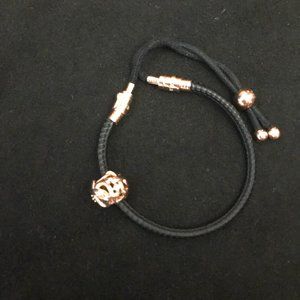 Pandora bracelet with rose-gold details